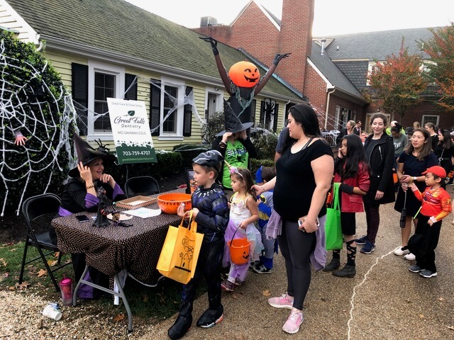 Children filing past our Halloween table