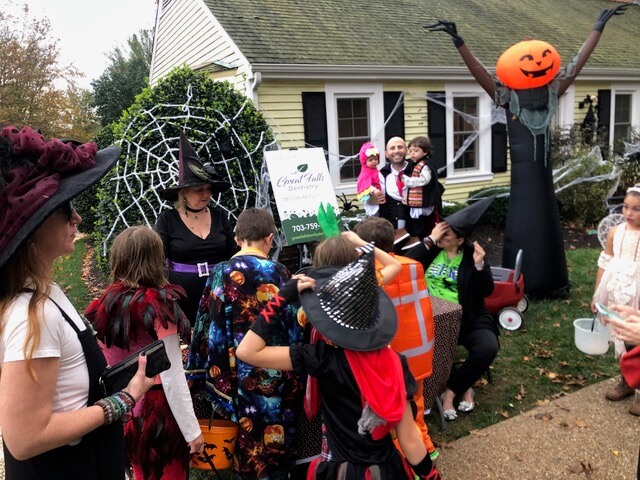 A group of children gather for candy at our halloween booth