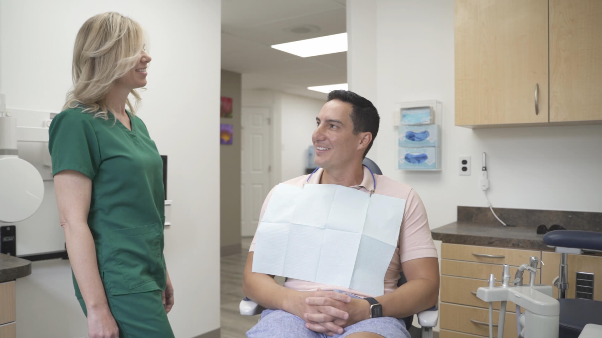 Julie conversing with a patient