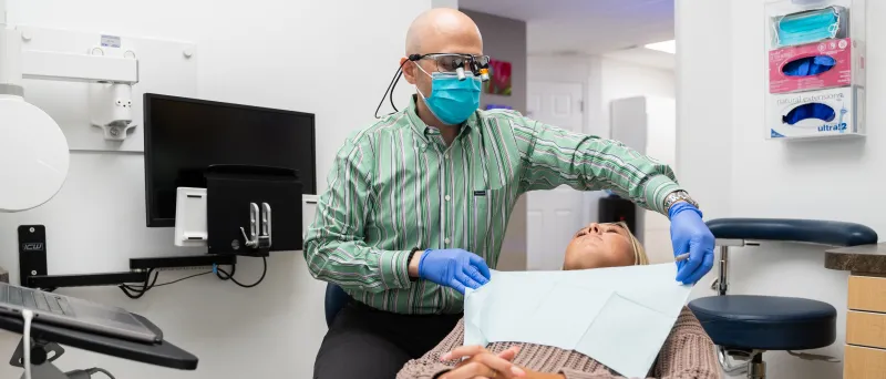 Dr. Dahman working with a patient