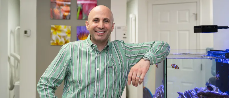 Dr. Dahman posing next to one of his fish